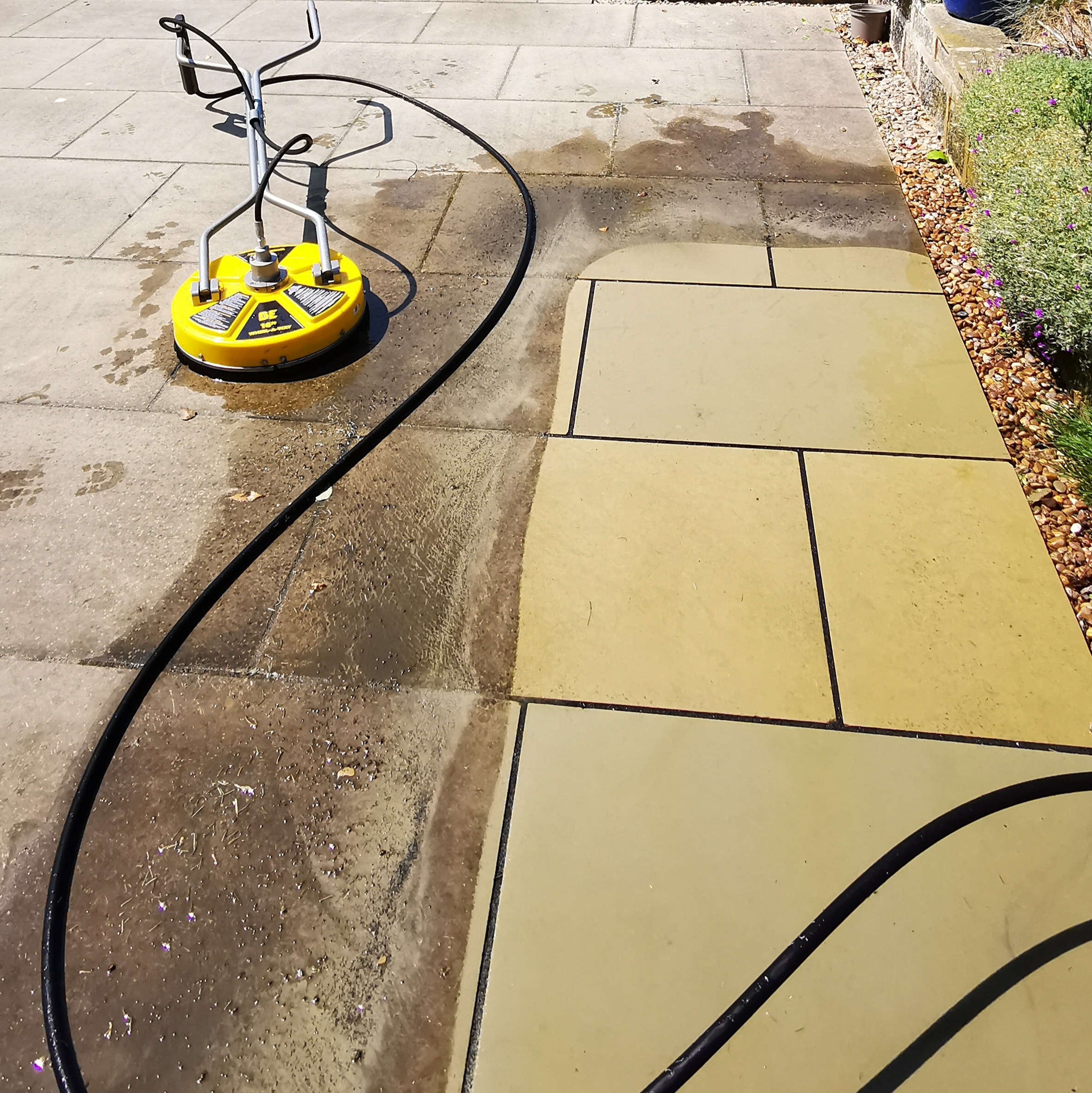 Patio pressure washing in progress